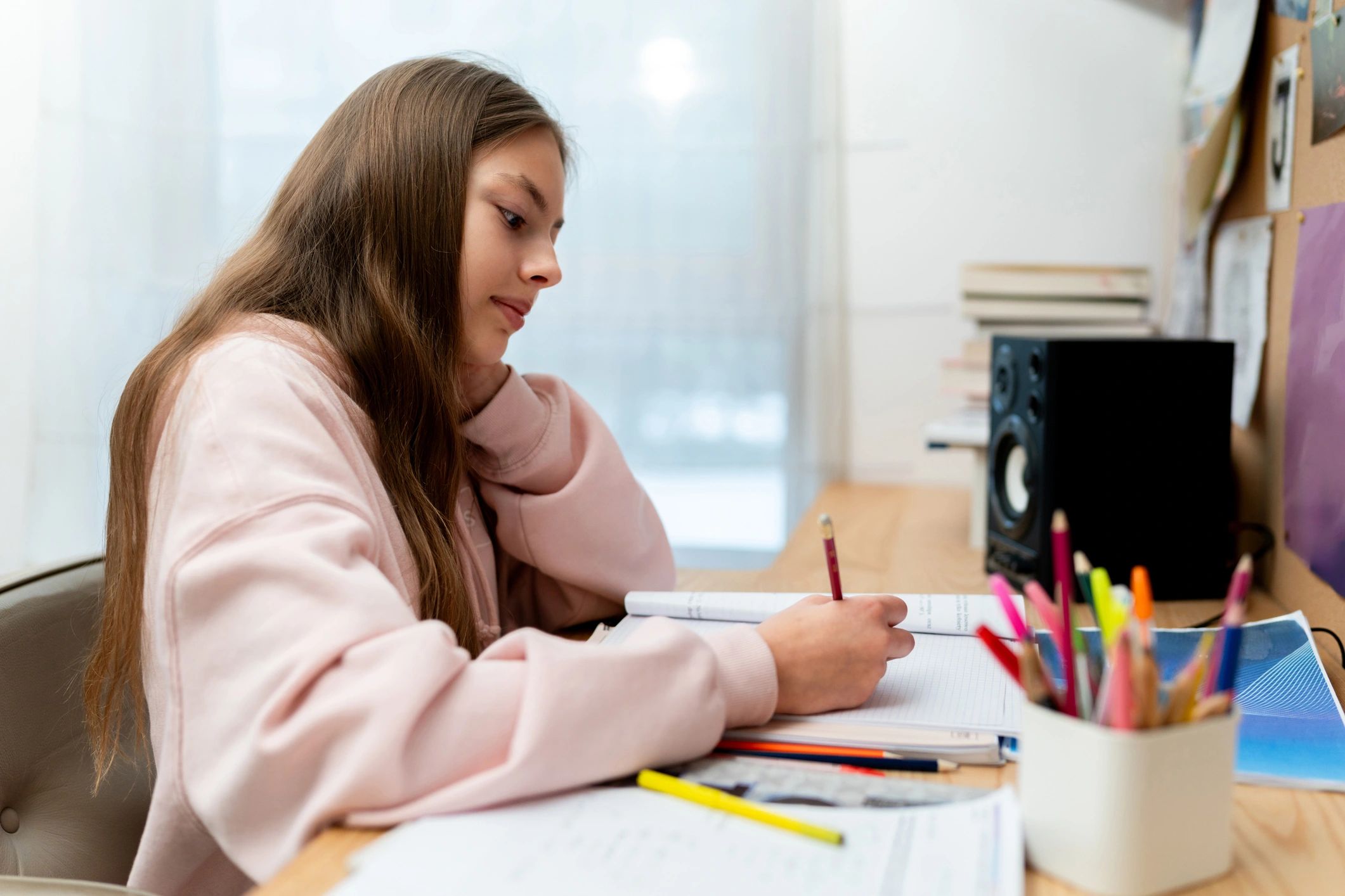 Student working attentively at a desk during an academic learning session