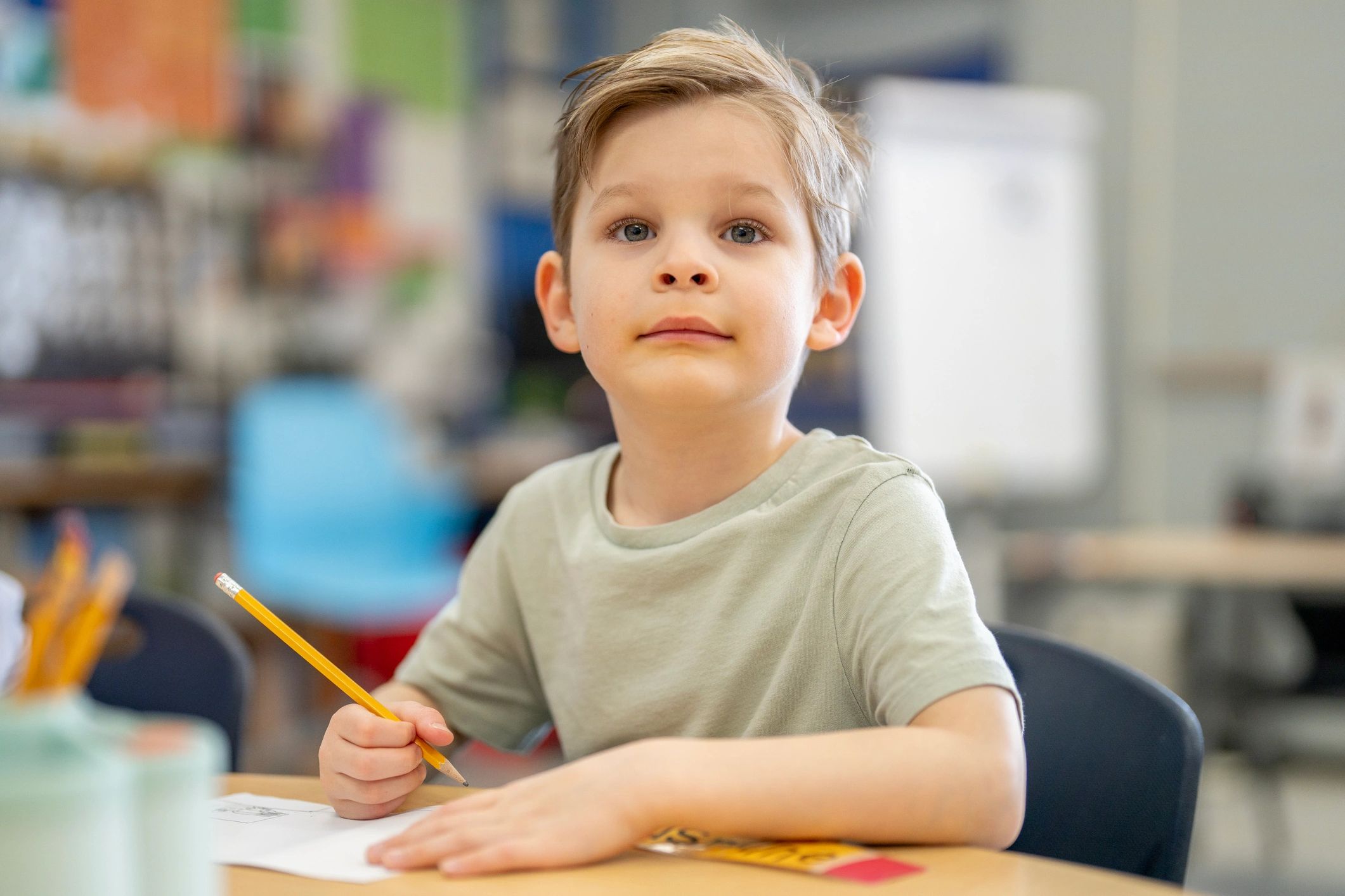 Student focused on schoolwork during an academic assessment setting